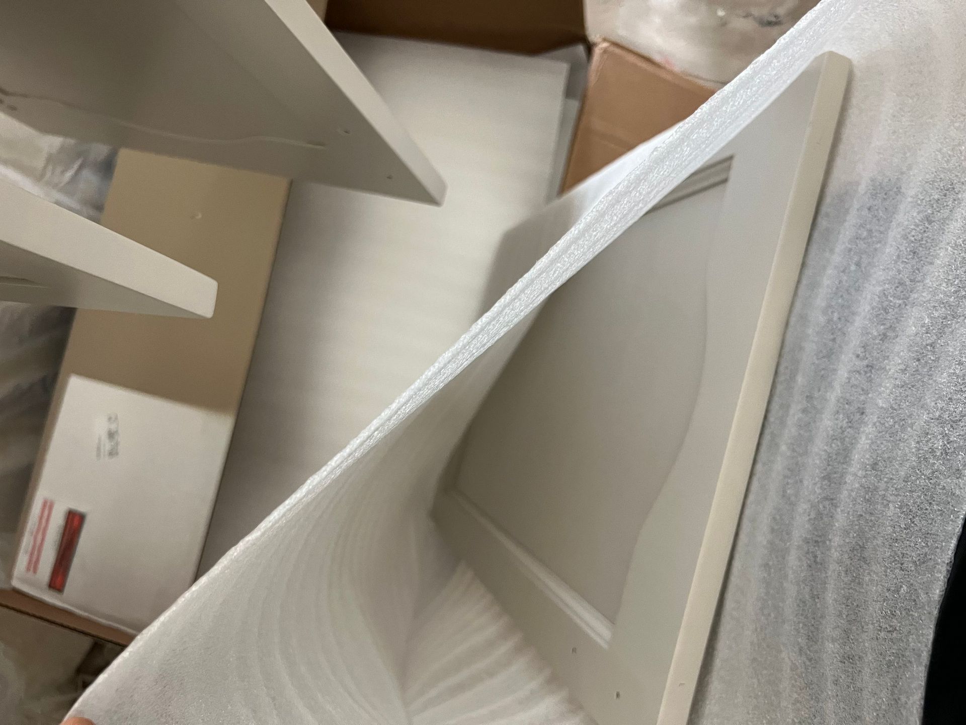 Cabinetry wrapped and protected for delivery