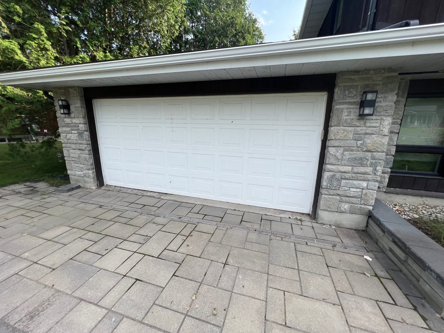 Garage door before repaint in Barrhaven