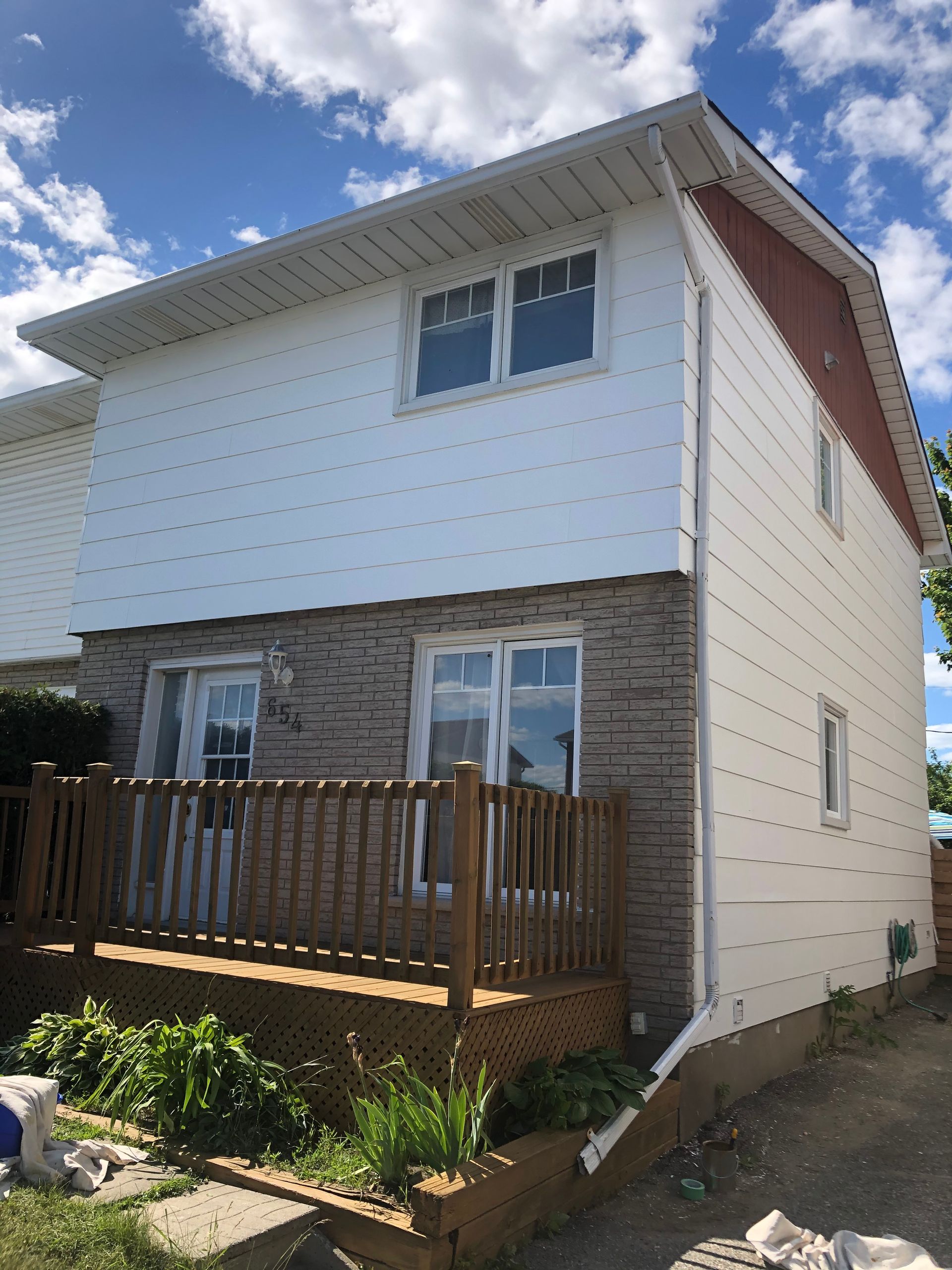 Before – siding in need of repainting